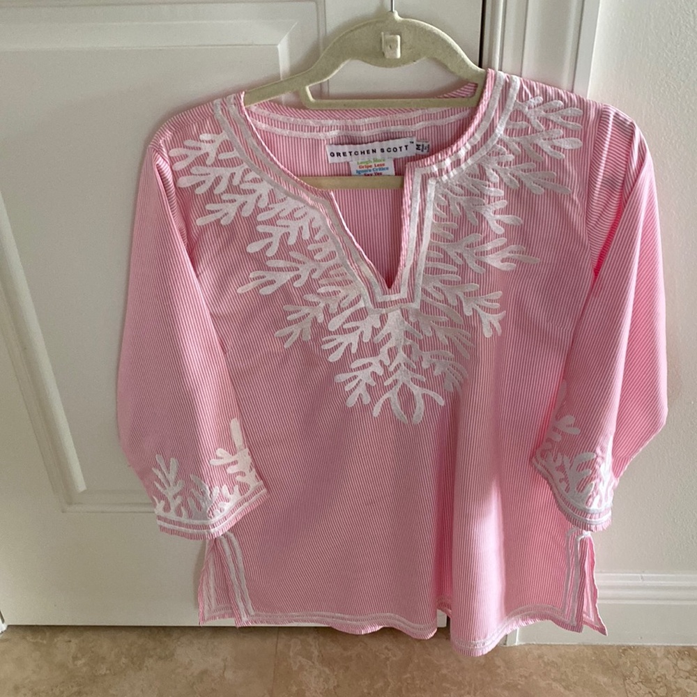 Womens blouse. The pink color is very soft.Hand or machine wash gentle